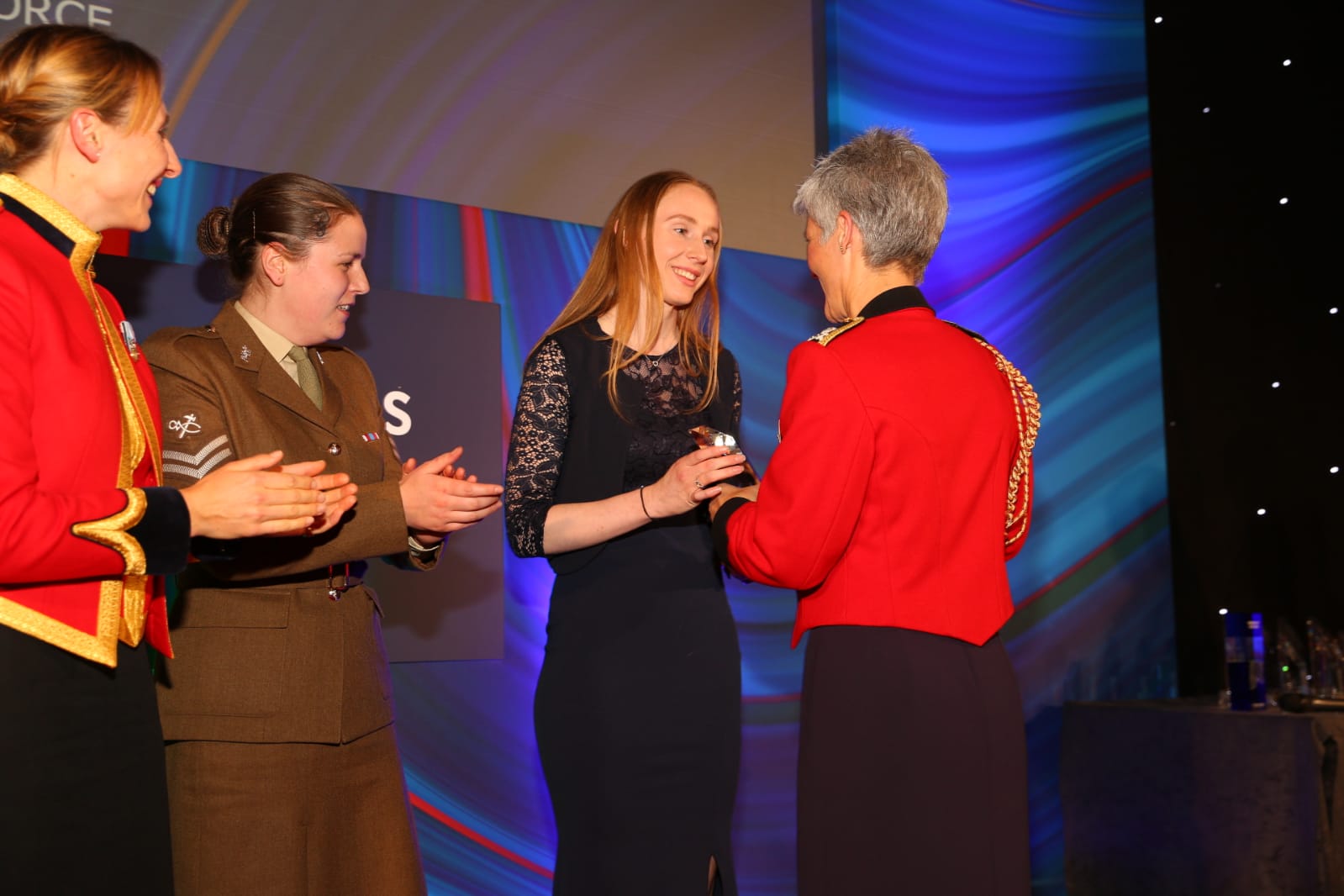 Image shows personnel receiving award.